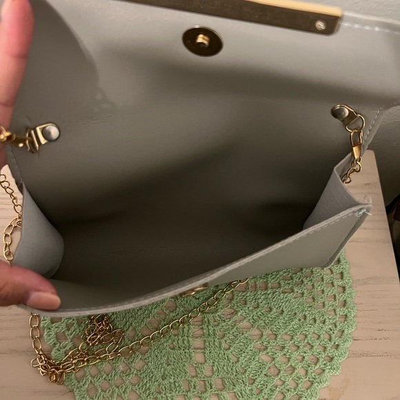 Non Brand Gray Crossbody, never used, smoke free home. Comes with a dust bag. - Picture 5 of 6